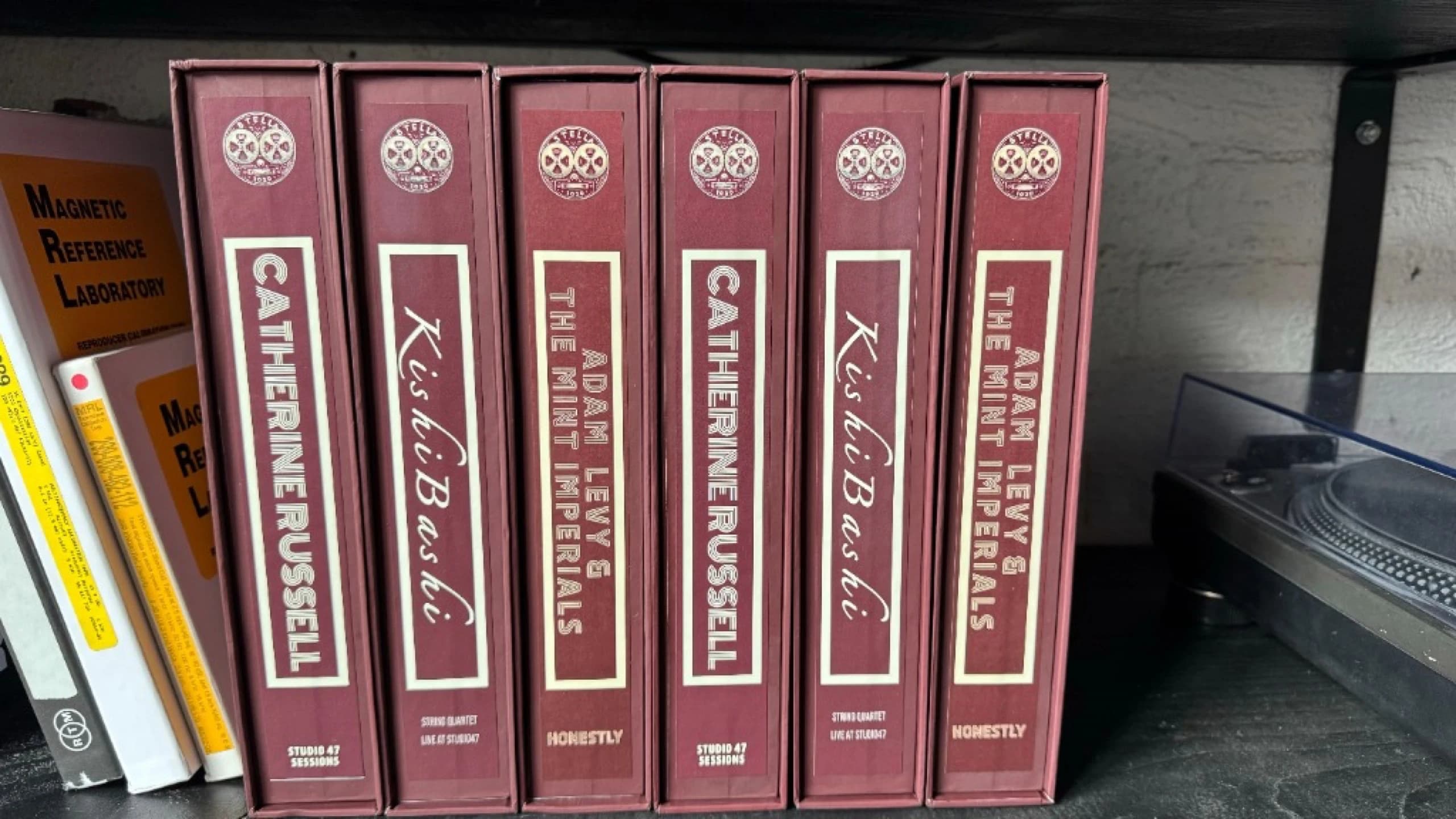 Professional tape reel package for Kishi Bashi with burgundy boxes