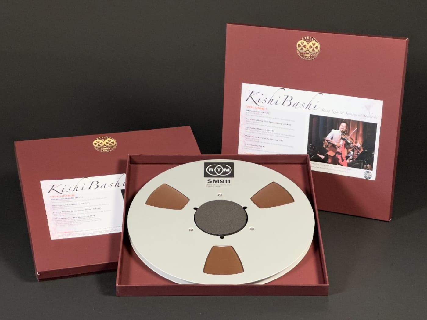 Complete Kishi Bashi album package with boxes and professional RTM tape reel