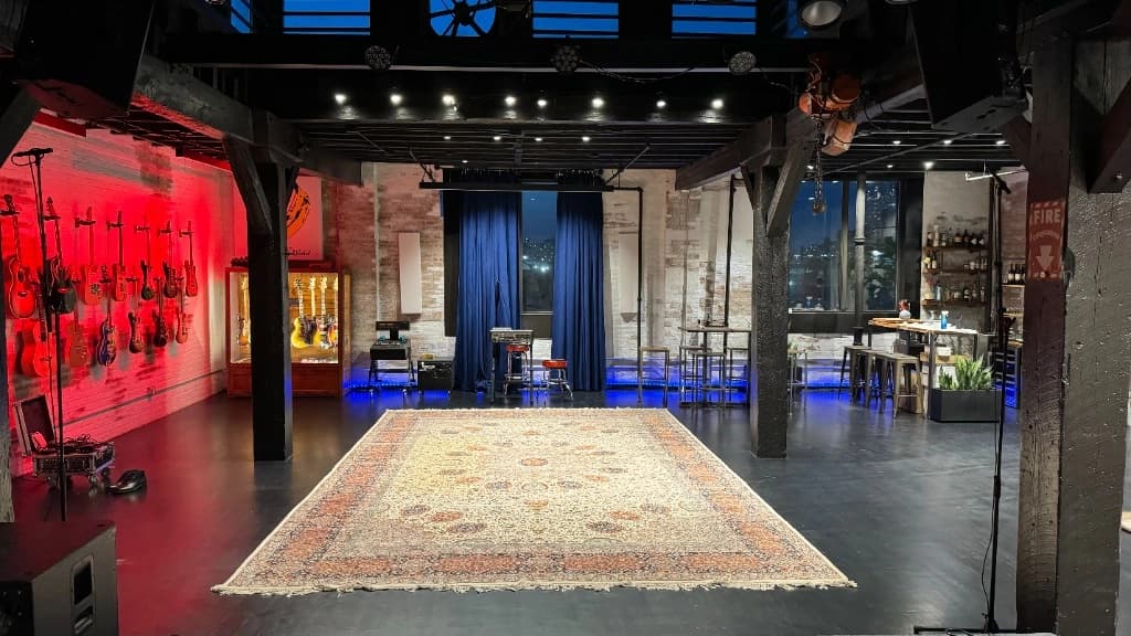 Studio47 performance space with stage, drum kit, and dramatic red lighting